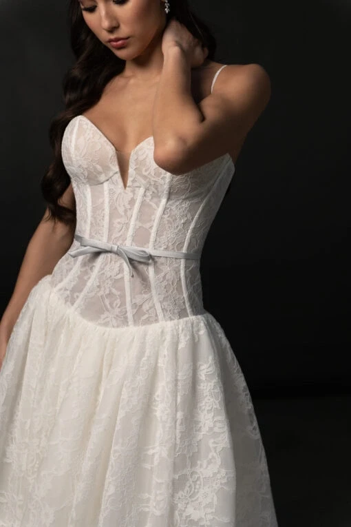 Model wearing a white gown by Martina Liana